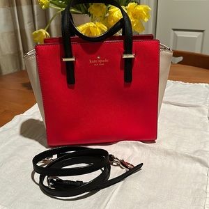 Kate Spade medium leather handbag, red/cream/black with crossbody strap.